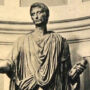 A cropped image of a statue of Caesar Augustus in his Senate robe. This is N.A. Ferrell's admin profile picture at The Emu Cafe Social.